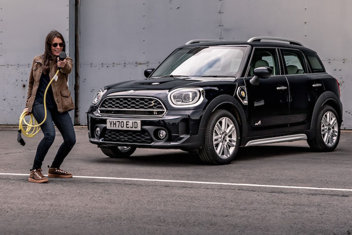Ginny Buckley next to Mini PHEV with charging cable